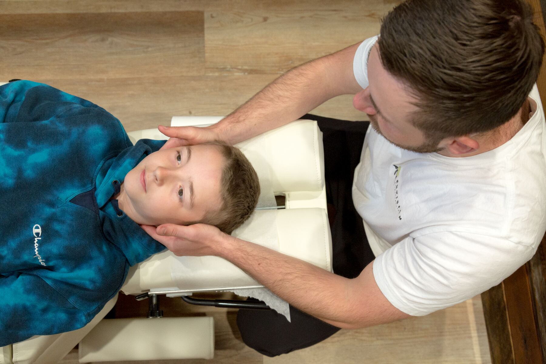 Dr. Dakota performing a chiropractic adjustment