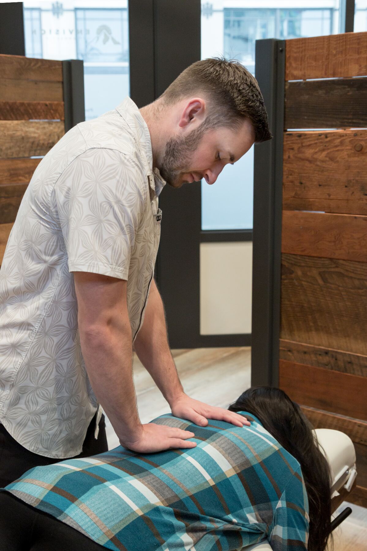 Dr. Dakota performing a chiropractic adjustment at Envision Chiropractic in Bellingham
