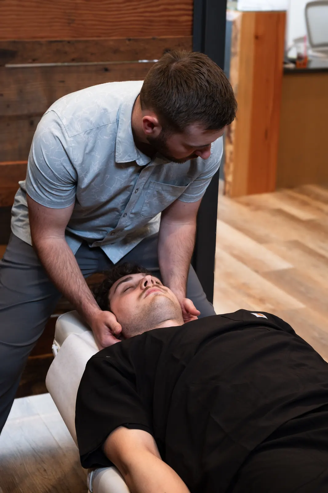 Dr. Dakota Turgeon, Bellingham chiropractor, performing a precise cervical adjustment at Envision Chiropractic