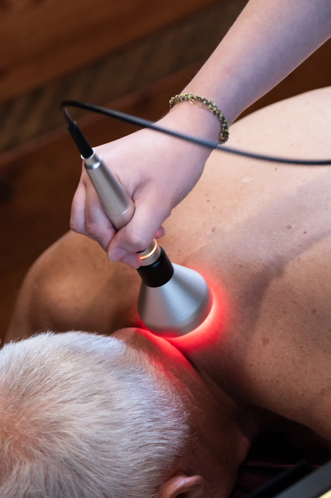 Class IV cold laser therapy treatment on the cervical spine at Envision Chiropractic in Bellingham, WA
