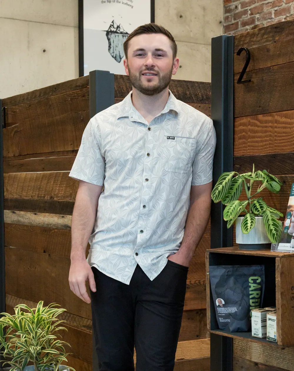 Chiropractor Bellingham WA Dakota Turgeon HP About Chiropractor Dakota Turgeon leaning against a wood wall